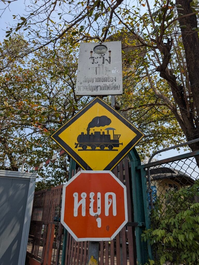 a sign in Thai for trains to stop