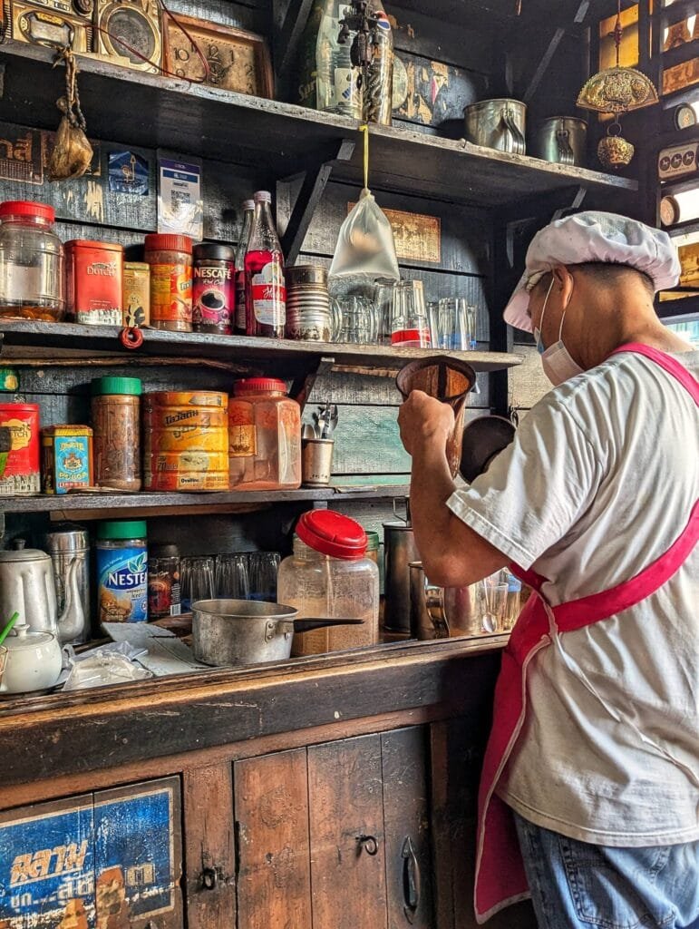 Barista uncle brewing an oliang coffee