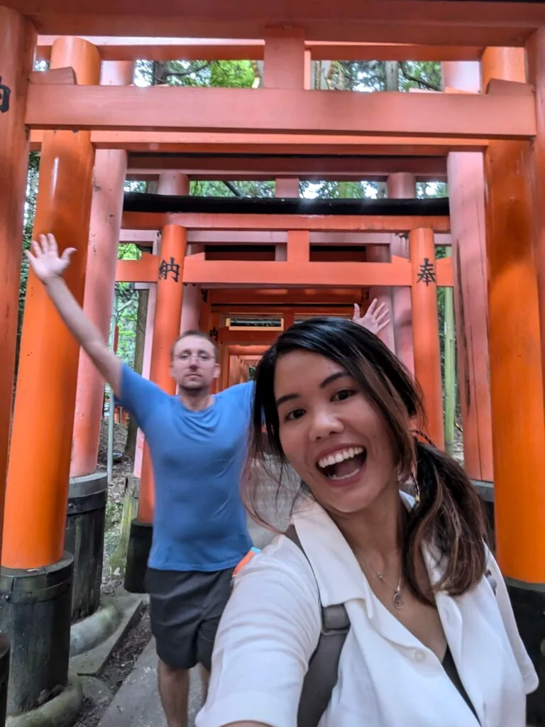 A photo of us among the Torii gates of the Fushimi Inari Shrine in Kyoto, Japan